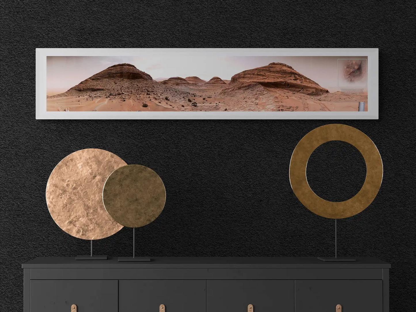 Framed panoramic poster of the Mars landscape captured by the Curiosity Rover, styled in a modern interior with golden circular sculptures on a black console.