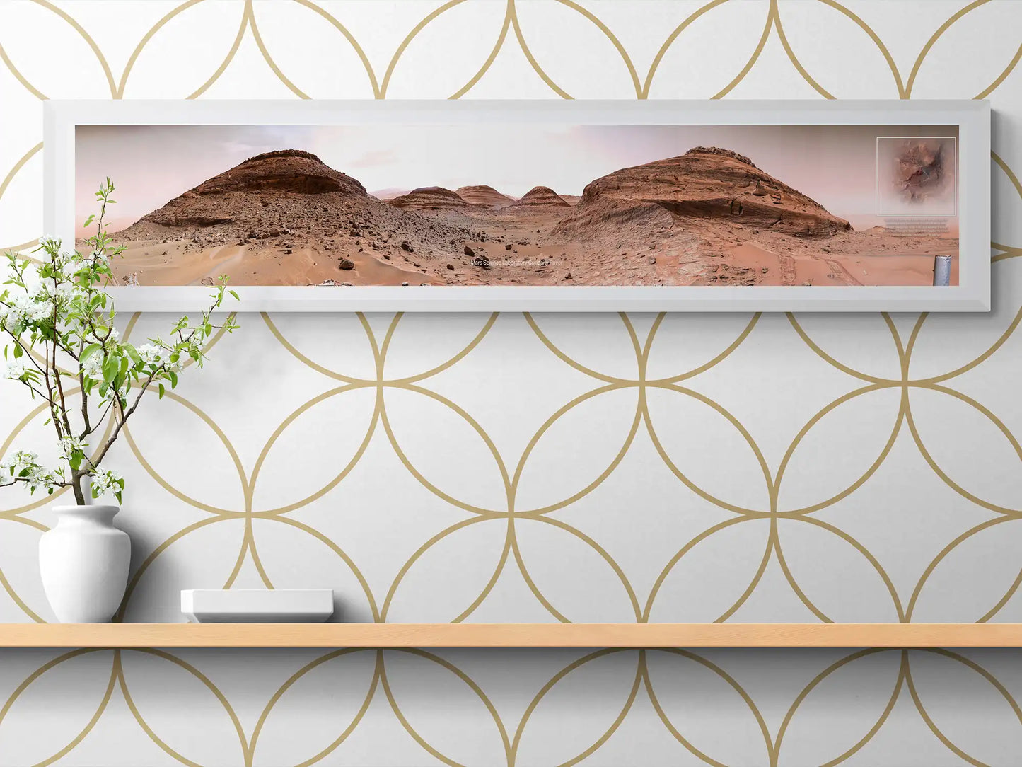 Framed panoramic Mars landscape poster, captured by the Curiosity Rover, styled on a minimalist wooden shelf with a white vase and geometric-patterned wallpaper.