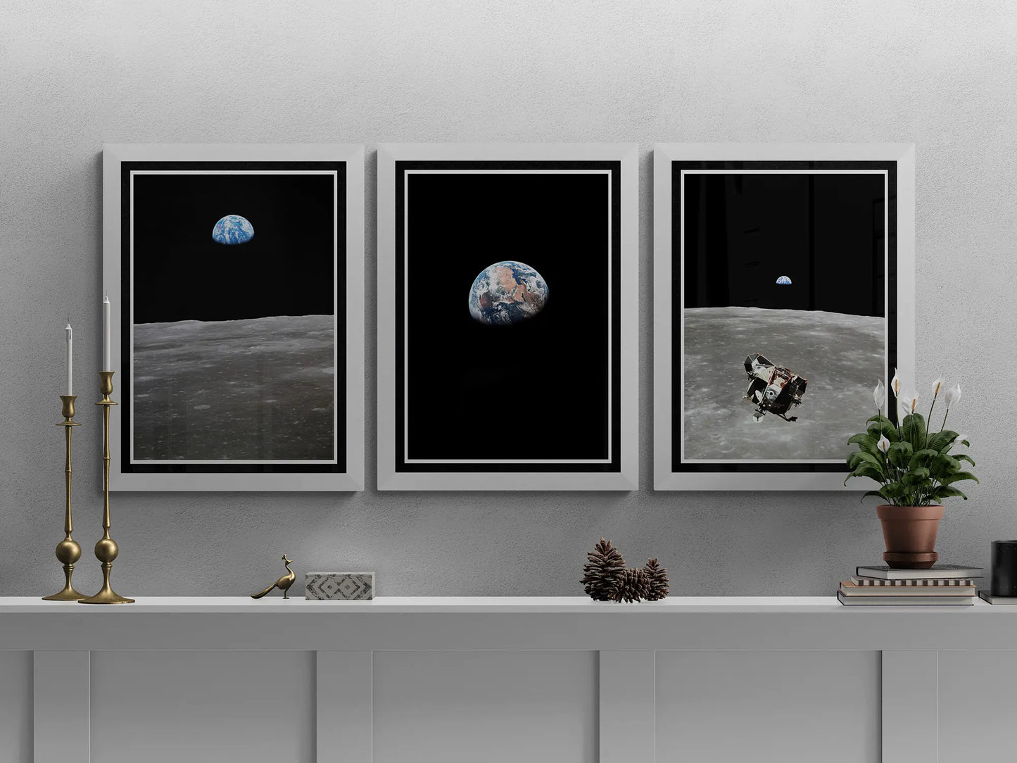 Apollo 11 poster set featuring Earthrise, Moon’s surface, and the Lunar Module, framed and styled on a white mantel with brass candlesticks, books, and a plant for an elegant display.