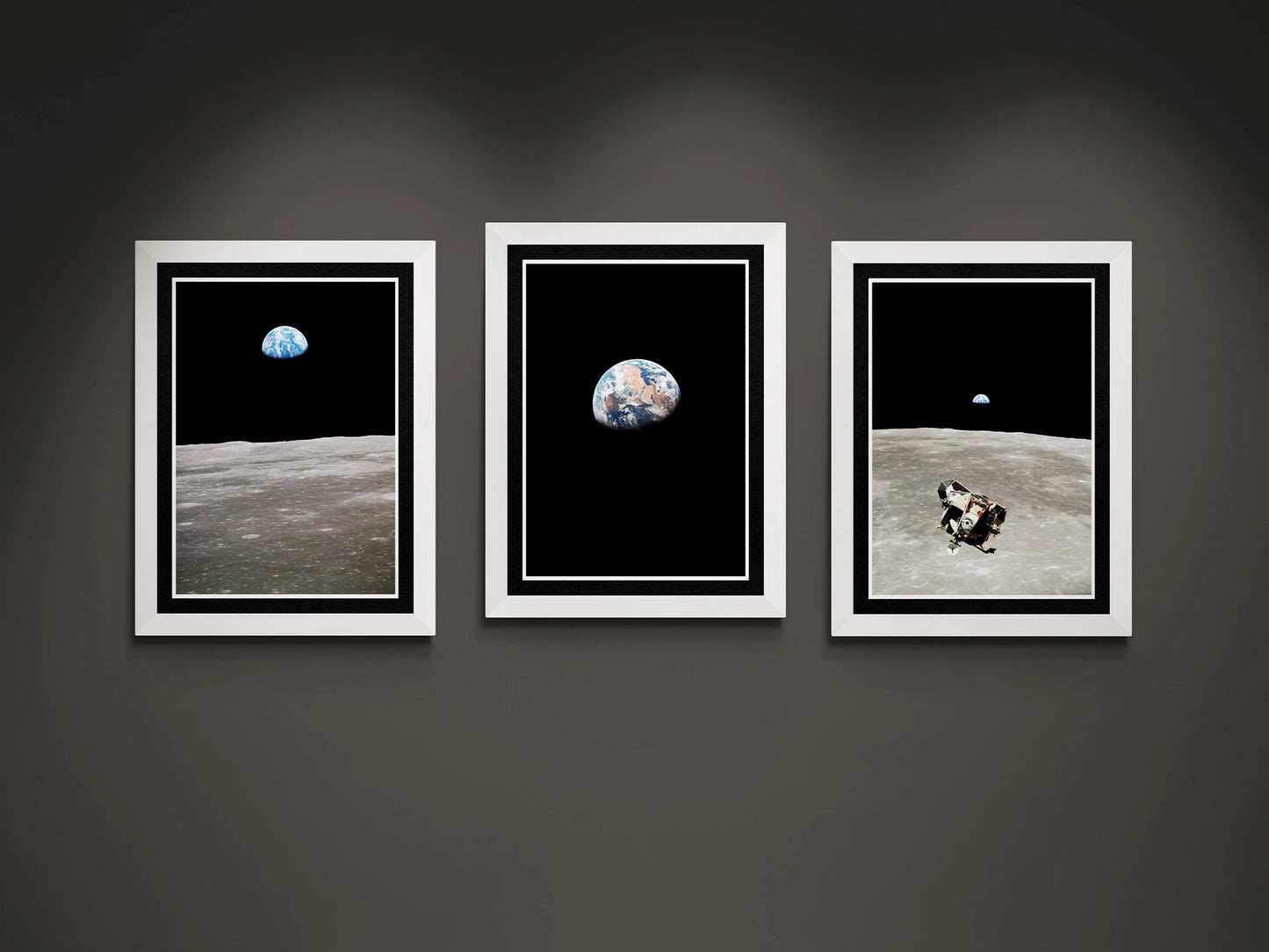 Set of three framed Apollo 11 posters featuring iconic views of Earthrise, the Moon’s surface, and the Lunar Module, celebrating the legacy of the first lunar landing.