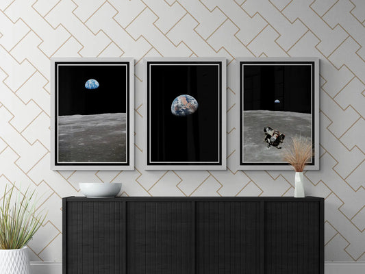 Set of three Apollo 11 posters featuring Earthrise, the Moon’s surface, and the Lunar Module, framed and displayed on a modern black console with geometric wallpaper and minimalist decor.