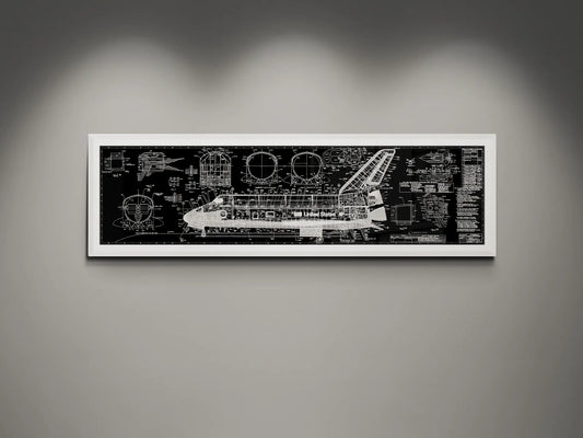 Framed NASA space shuttle blueprint wall art featuring detailed white engineering schematics and technical diagrams on a black background, displayed on a modern gray wall.