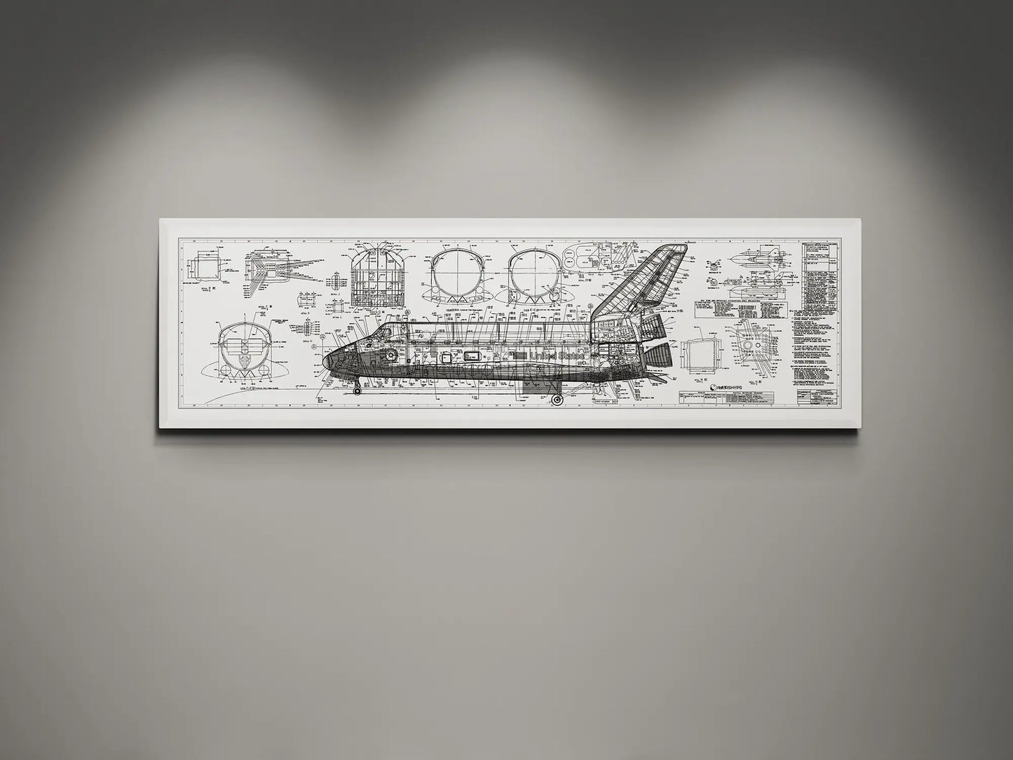 Framed NASA space shuttle blueprint wall art featuring detailed white engineering schematics and technical diagrams on a black white background, displayed on a modern gray wall.