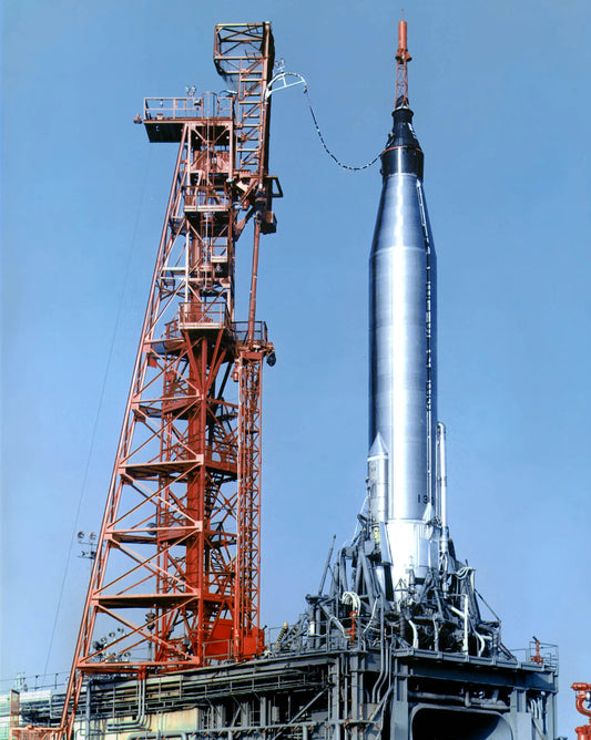 Historic Atlas rocket on launch pad, showcasing its gleaming metallic body and intricate support structures, pivotal in NASA's early space exploration