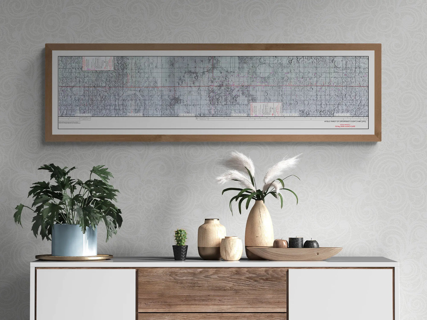 Apollo 10 Lunar Map | Apollo 10 Moon Map | Rocket Blueprint Posters | A detailed Apollo target of opportunity flight chart blueprint is framed and hung on a patterned gray wall. The modern cabinet below features potted plants, wooden vases, and other small decorative objects, creating a stylish display.
