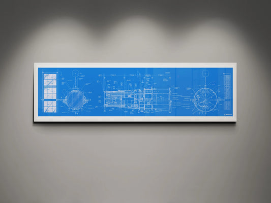 Hubble Space Telescope Blueprint | Rocket Blueprint Posters | A detailed blueprint of the NASA Hubble Space Telescope displayed in a white frame against a gray wall. The blueprint features technical schematics in white on a blue background, illuminated by subtle overhead lighting.