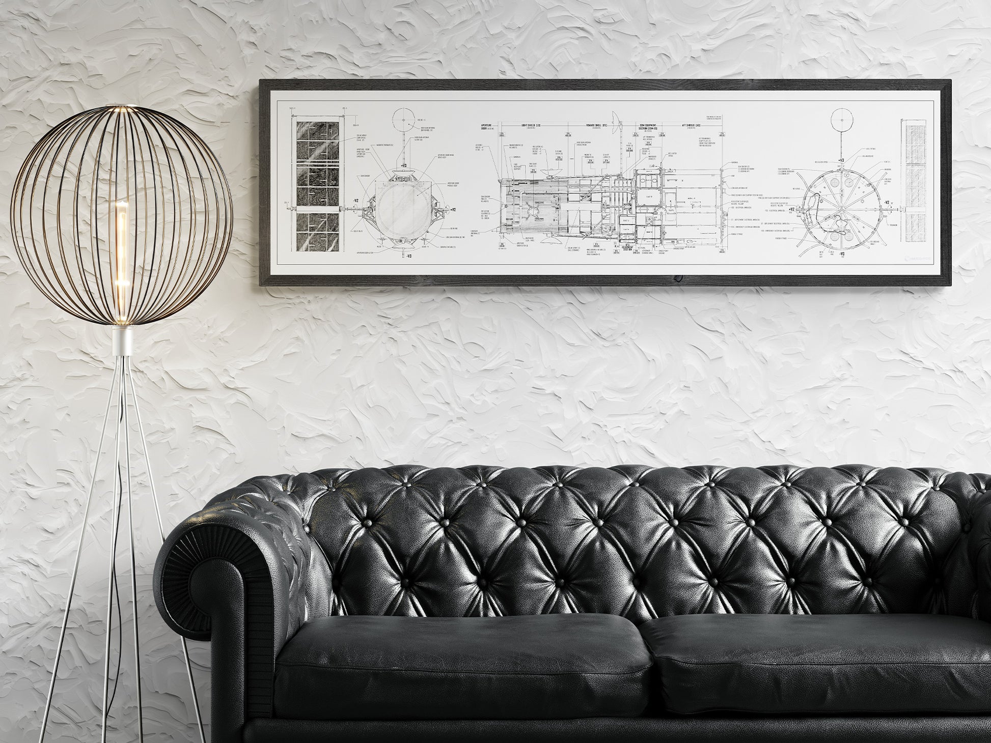 Hubble Space Telescope Blueprint | Rocket Blueprint Posters | A white-framed blueprint of the NASA Hubble Space Telescope hangs on a textured white wall above a black leather tufted sofa. A modern floor lamp with a spherical wireframe design stands to the left of the sofa, adding a stylish touch to the contemporary living space.