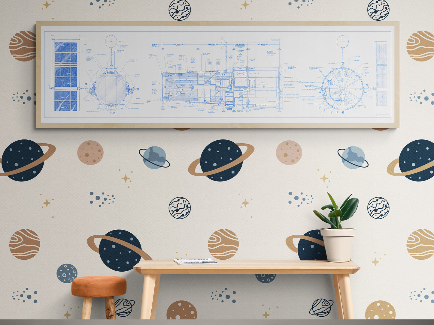 Hubble Space Telescope Blueprint | Rocket Blueprint Posters | The image shows a kids' playroom with a white-framed Hubble Space Telescope blueprint hanging on a space-themed wallpapered wall. The wallpaper is decorated with various planets and stars. Below, a light wood desk and an orange stool create a playful study area with a small plant adding a touch of greenery.