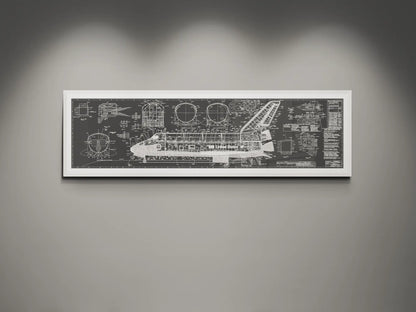 Framed NASA space shuttle blueprint wall art featuring detailed white engineering schematics and technical diagrams on a charcoal background, displayed on a modern gray wall.