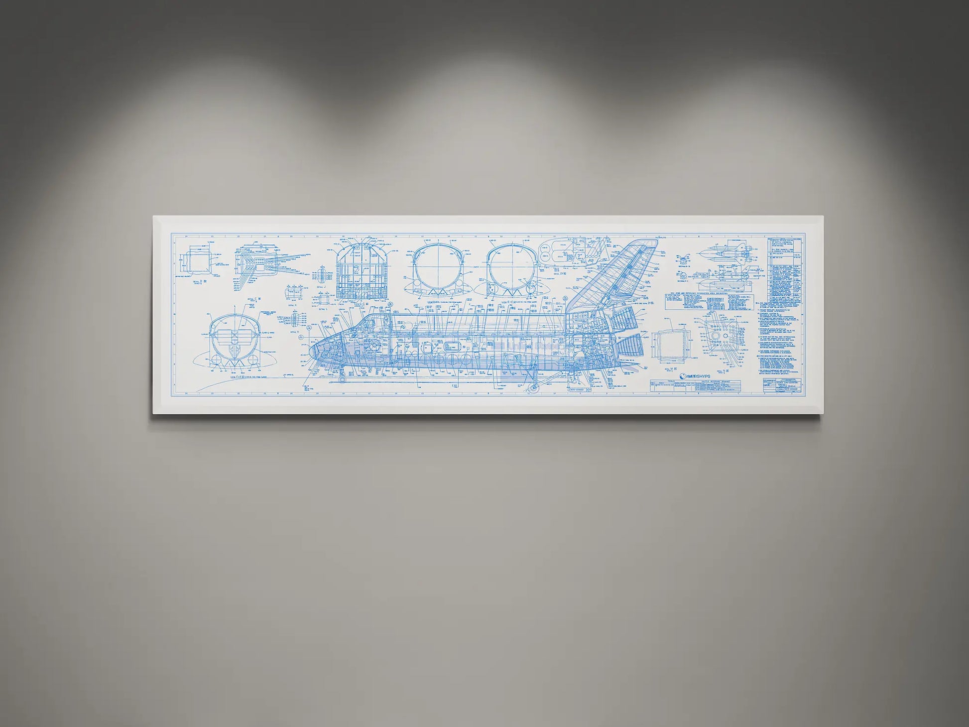 Framed NASA space shuttle blueprint wall art featuring detailed white engineering schematics and technical diagrams on a white background, displayed on a modern gray wall.